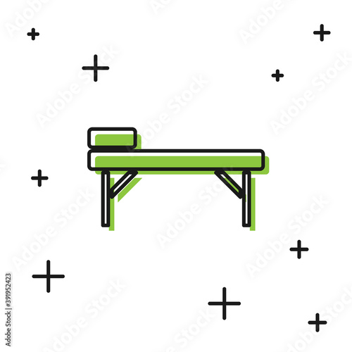 Black Massage table icon isolated on white background. Vector.