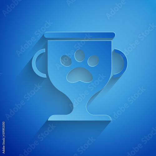 Paper cut Pet award symbol icon isolated on blue background. Medal with dog footprint as pets exhibition winner concept. Paper art style. Vector.