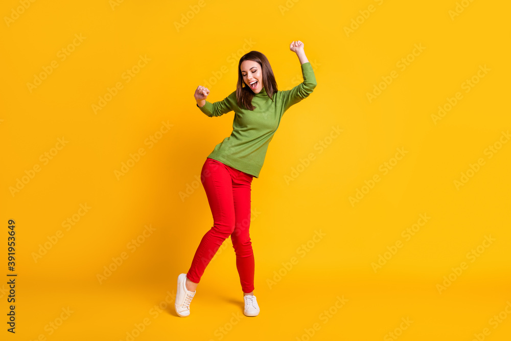 Full length body size view of pretty slender funky cheerful girl dancing having fun chill rest isolated bright yellow color background Full length body size view of pretty slender funky cheerful girl dancing having fun chill rest isolated bright yellow color background
