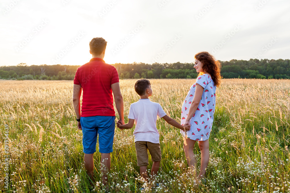 A rear view of the happy family spending time together A rear view of the happy family spending time together