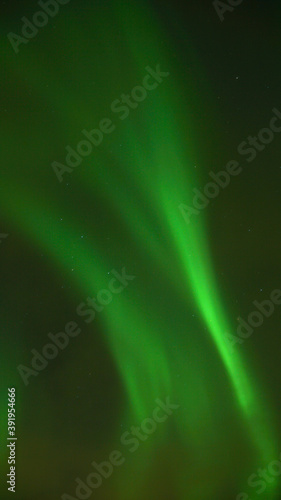 Aurora Borealis Northern Lights seen on a cold winter day in Narvik, Norway. photo