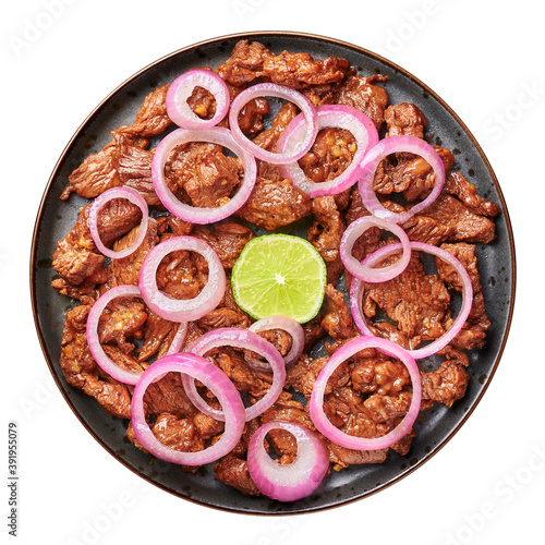 Bistek Tagalog or Bistec Encebollado isolated on white. Filipino spanish cuisine beef steak with onion. Top view photo