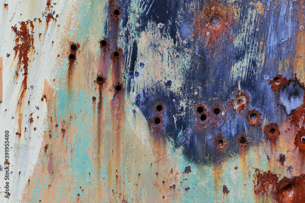 Abstract grunge metal texture. Brown metal surface with rust and bullet holes. Wallpaper with bullet holes for design. Weathered metal wall. Metal door with corrosion and rust.