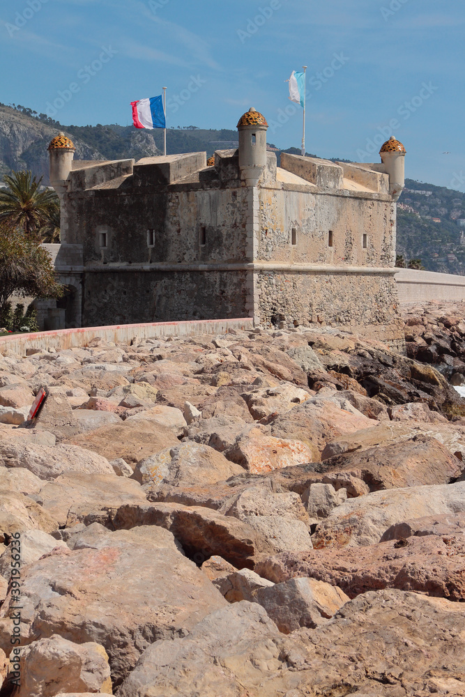 Old bastion and rocky shore. Menton, France Old bastion and rocky shore. Menton, France