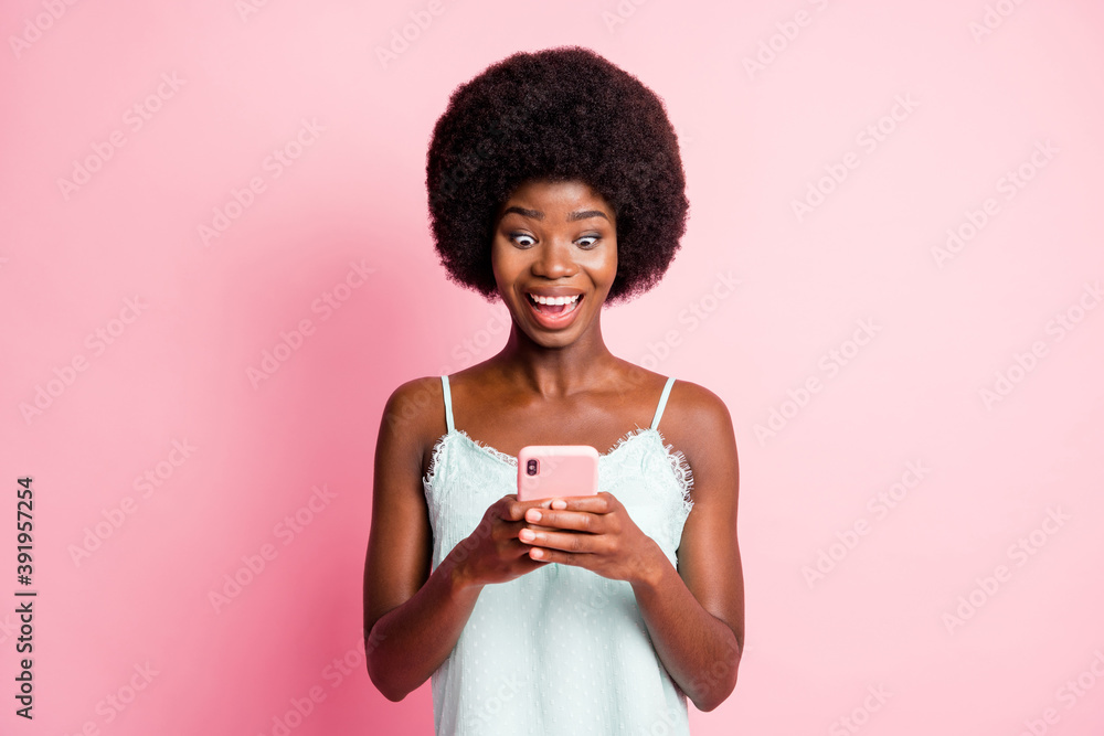 Portrait of beautiful brown haired stylish trendy lady hold look phone like reaction wear tank-top isolated on pink color background Portrait of beautiful brown haired stylish trendy lady hold look phone like reaction wear tank-top isolated on pink color background