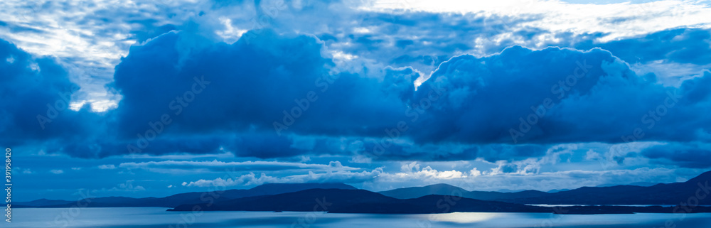 picturesque view on sea coastline and cloudy sunset sky picturesque view on sea coastline and cloudy sunset sky