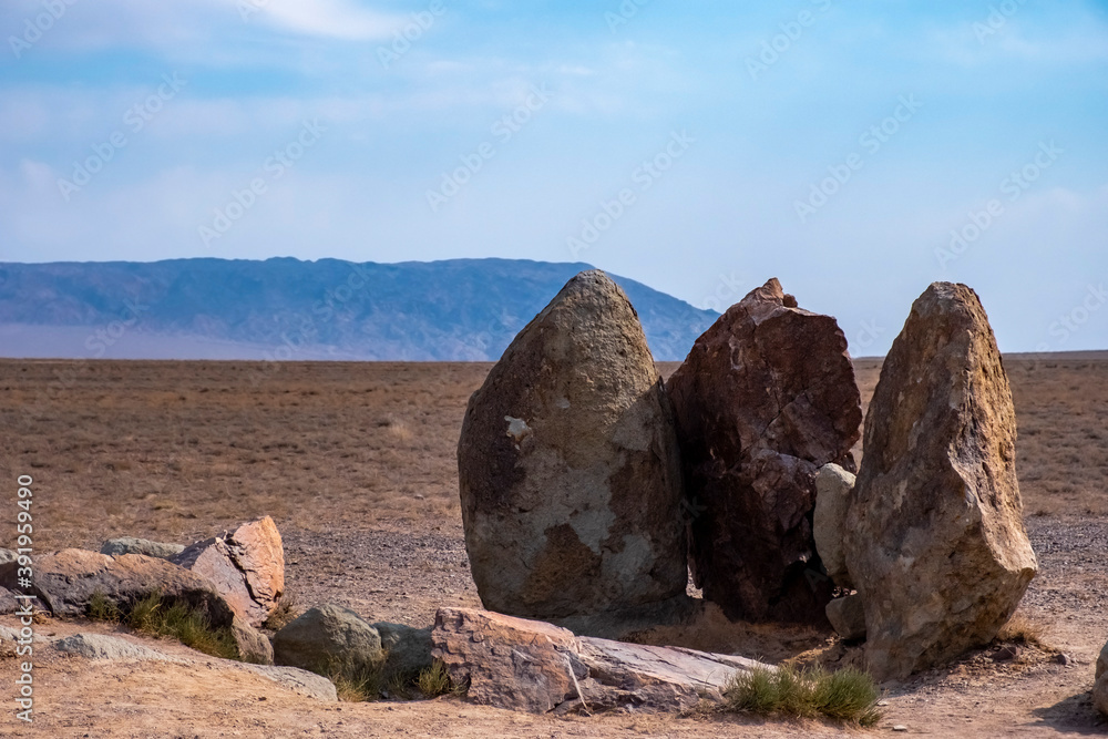 Osaktas stone stellas in Altyn-Emel national park in Kazakhstan. Tourism, travel concept.