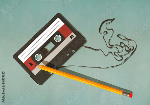 Pencil unwinding cassette tape on green background
