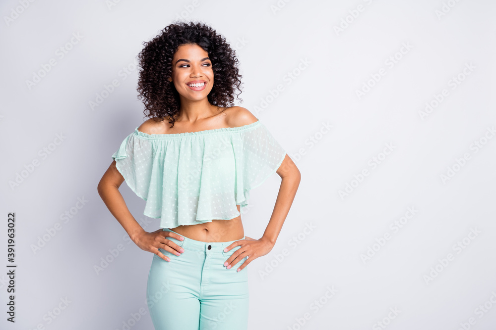 Photo portrait of girl with two hands on waist looking at blank space isolated on white colored background Photo portrait of girl with two hands on waist looking at blank space isolated on white colored background