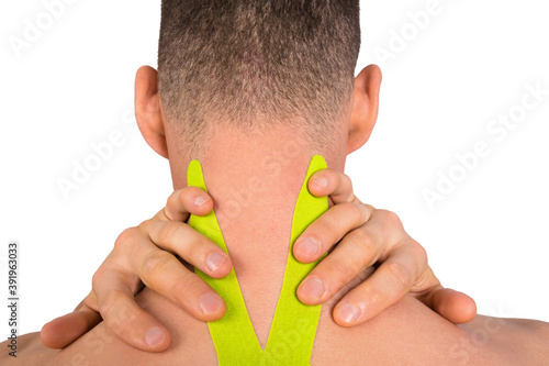 two hands of a man holding his neck with medical tape applied to relieve pain, isolated on white