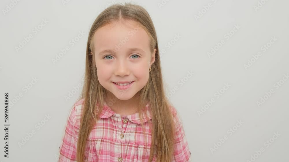 Portrait of a happy child girl on a white background. Portrait of a happy child girl on a white background.