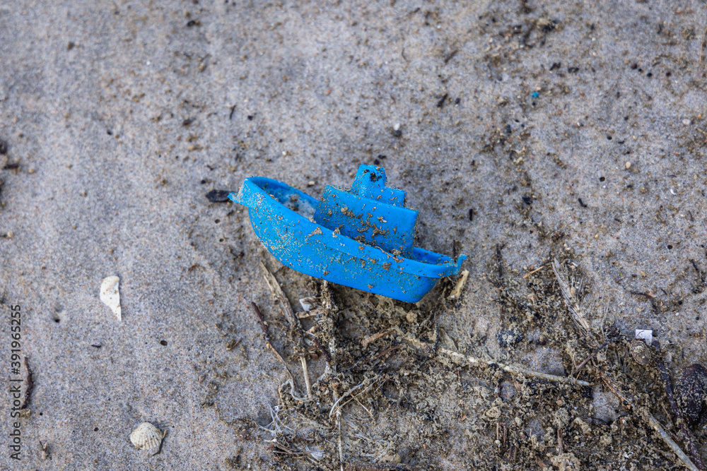 Lost plastic sand toy on Baltic Sea beach on Vistula Spit between Vistula Lagoon and Bay of Gdansk, near Katy Rybackie village, Poland Lost plastic sand toy on Baltic Sea beach on Vistula Spit between Vistula Lagoon and Bay of Gdansk, near Katy Rybackie village, Poland