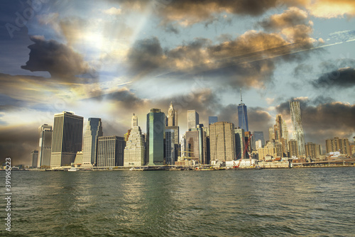 Downtown Manhattan skyline from Brooklyn Bridge Park - New York City at sunset © jovannig