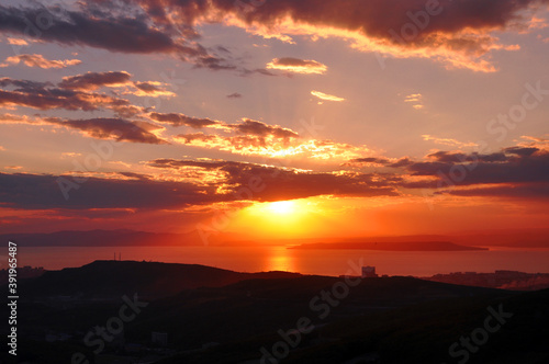 Sunset over the sea and beautiful cloudscape. Japanese sea  Vladivostok city  Primorsky Krai  Russia.