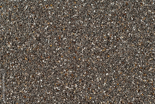 Chia seeds close up. Grain texture on a black background.