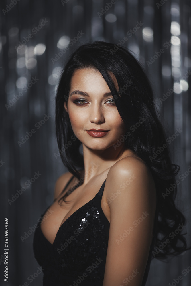 Fototapeta premium Celebrating woman in black dress