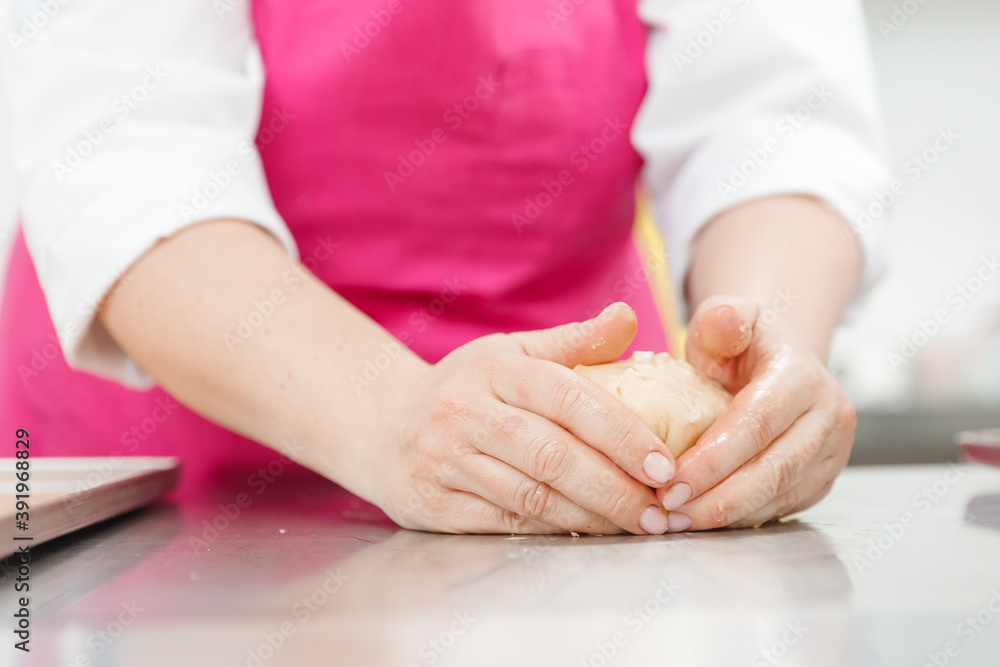 Step-by-step Easter cake, pastry chef prepares dough with raisins for festive kulich