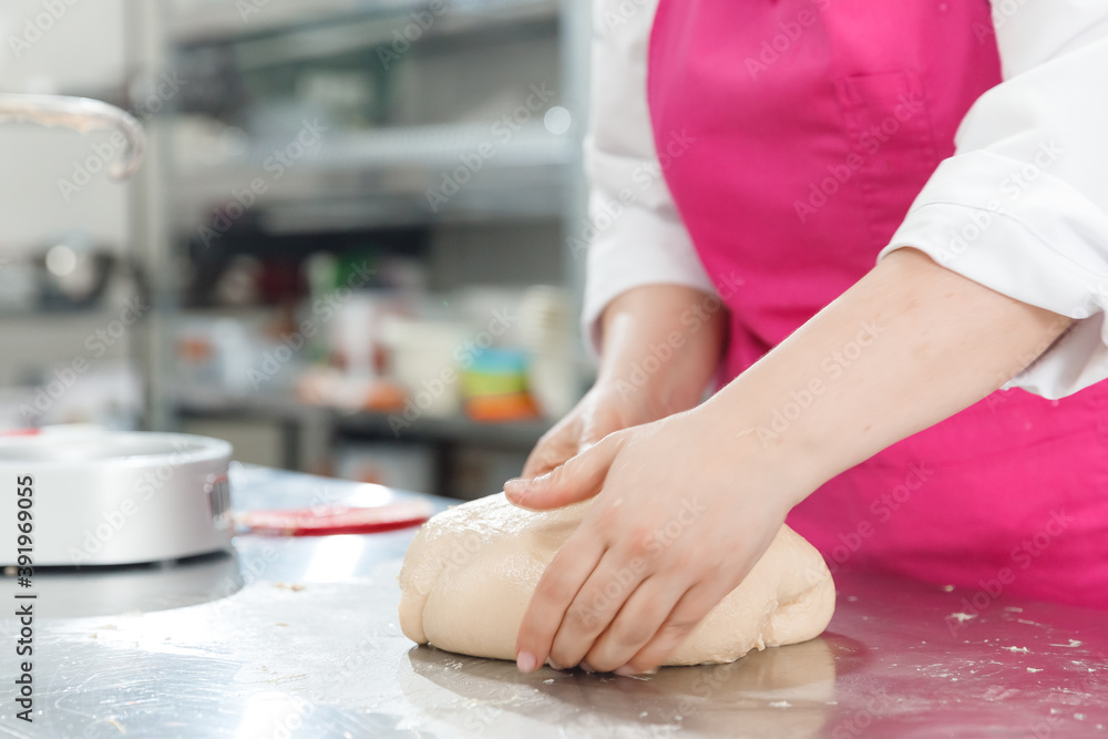 Step-by-step Easter cake, pastry chef prepares dough with raisins for festive kulich