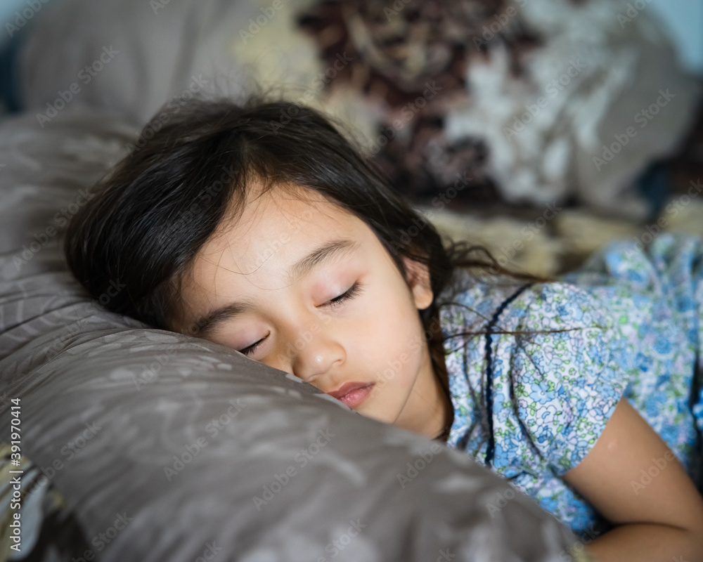 Daytime sleeping time of a toddler child. Little girl sleeping on the bed. Daytime sleeping time of a toddler child. Little girl sleeping on the bed.