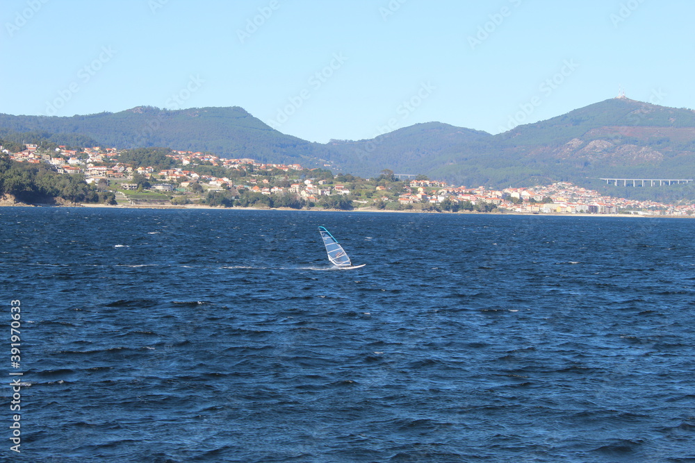 windsurfing on the blue sea