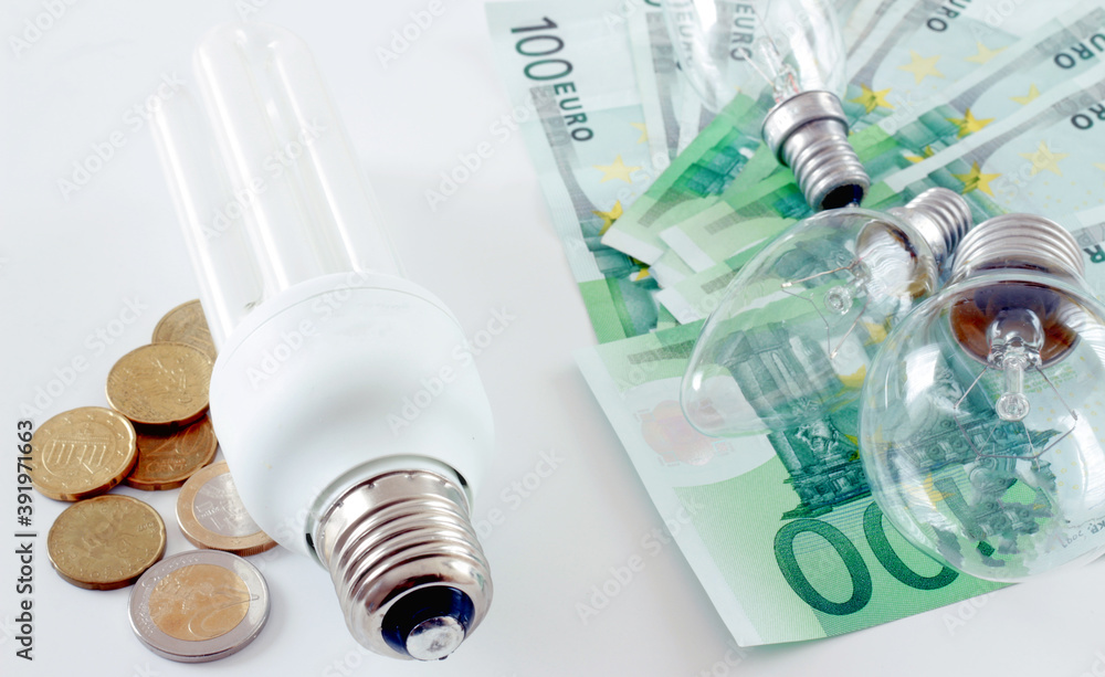 Energy saving concept. Saving bulb, versus ordinary bulb. Energy saving concept. Saving bulb, versus ordinary bulb.