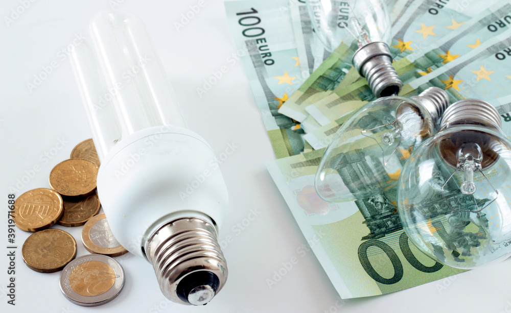 Energy saving concept. Saving bulb, versus ordinary bulb. Energy saving concept. Saving bulb, versus ordinary bulb.