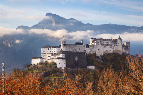 Obraz na płótnie Hohensalzburg Fortress. Image of Hohensalzburg Fortress with mountain range in the background located in Salzburg, Austria at beautiful autumn sunrise. w salonie