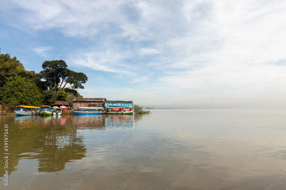 Tourist motorboats at shore on lake tana by blue nile river in Ethiopia Tourist motorboats at shore on lake tana by blue nile river in Ethiopia