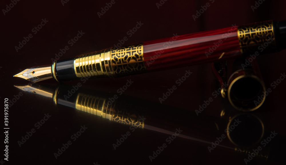 Fountain pen, beautiful fountain pen in detail on shiny black surface, low  key image, selective focus. Stock Photo | Adobe Stock