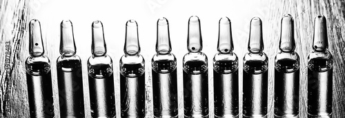 ampoules medicine vaccine concept, abstract background, vaccination virus protection