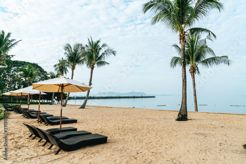beach chair with palm tree on beach © topntp