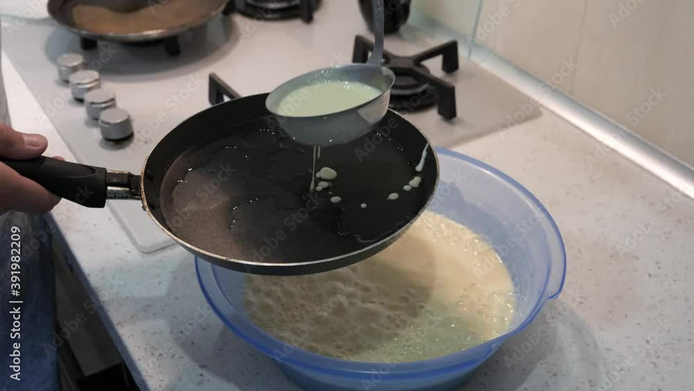 preparation of thin ruddy pancakes. baking in a pan preparation of thin ruddy pancakes. baking in a pan