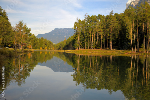Spiegelung im Hubersee bei Völs am Schlern in Südtirol photo