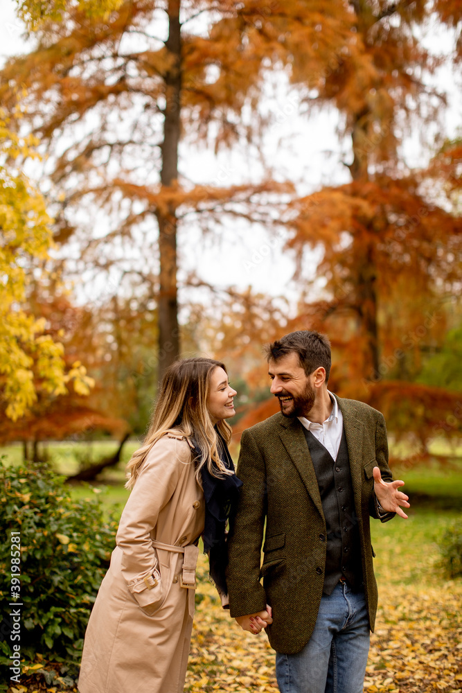 Young couple walking in the autumn park Young couple walking in the autumn park
