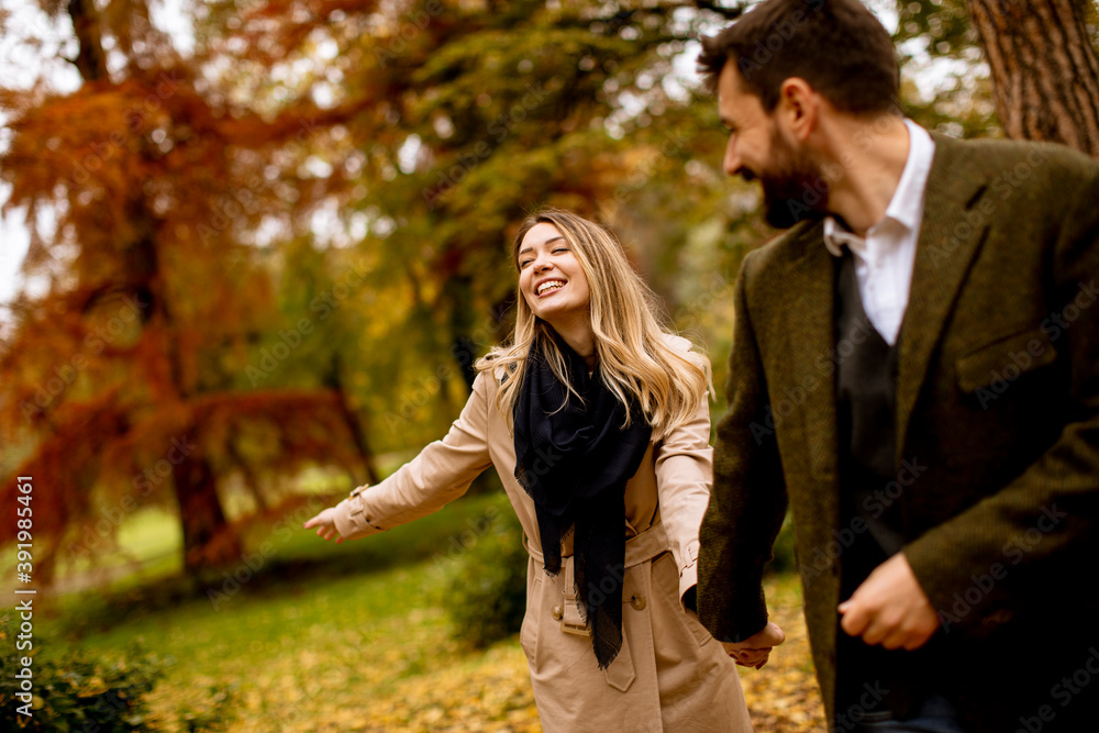 Young couple walking in the autumn park Young couple walking in the autumn park