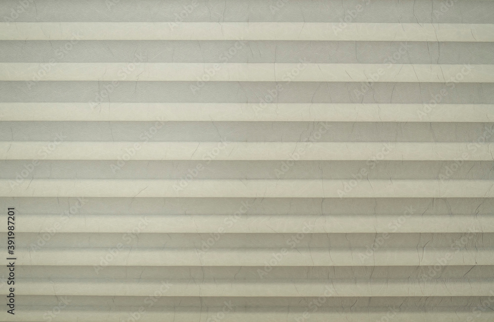 New white accordion fold cardboard wtih many lines close New white accordion fold cardboard wtih many lines close