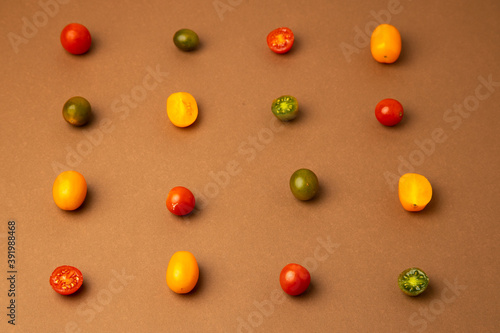 various kinds of mini tomatoes on brown background