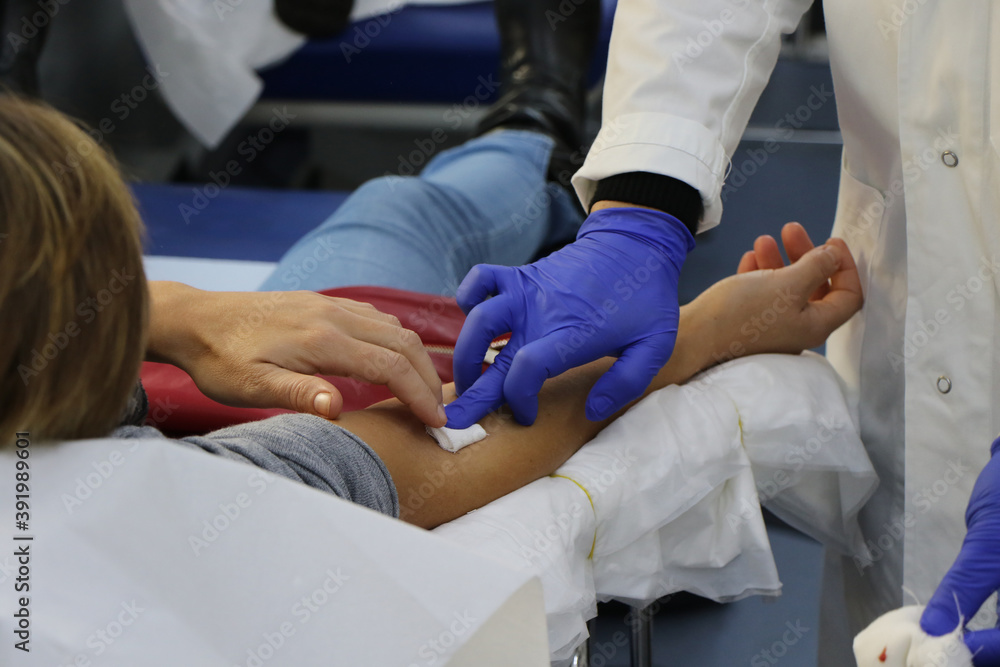 Blood donation. Volunteer donates blood in the hospital Blood donation. Volunteer donates blood in the hospital
