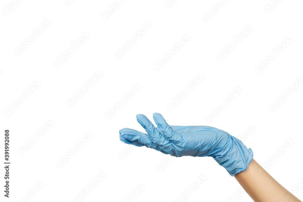 Female doctor's hand in sterile blue surgical gloves in holding position isolated on white Female doctor's hand in sterile blue surgical gloves in holding position isolated on white