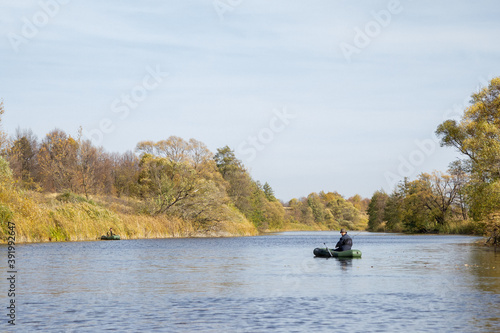 Fisherman in a boat on river