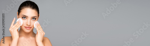 beautiful woman with cotton pads isolated on grey, banner