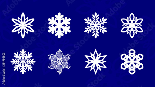 Set of vector snowflakes. White snowflake vector icon set on blue color background . Christmas Winter snow flake crystal elements. Cutout pattern of Christmas or New Year decoration. 