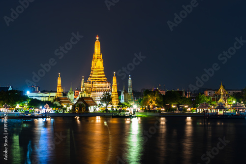 Wat Arun with Chao Phraya river at night in Bangkok, Thailand