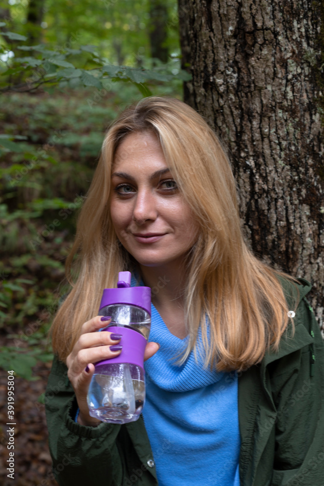 Beautiful woman alone in the forest in autumn Beautiful woman alone in the forest in autumn