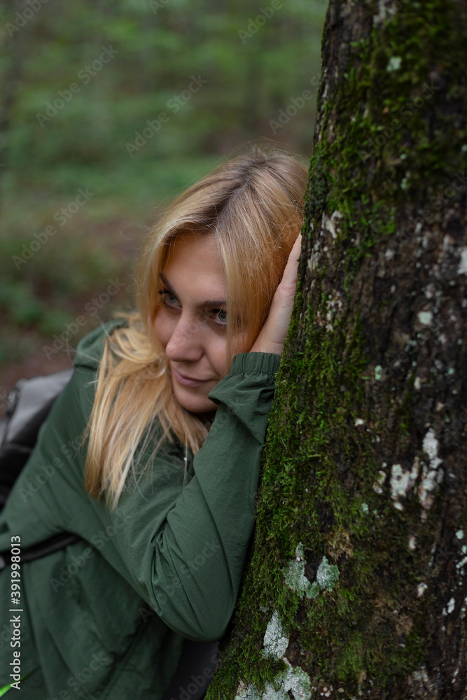 Beautiful woman alone in the forest in autumn Beautiful woman alone in the forest in autumn