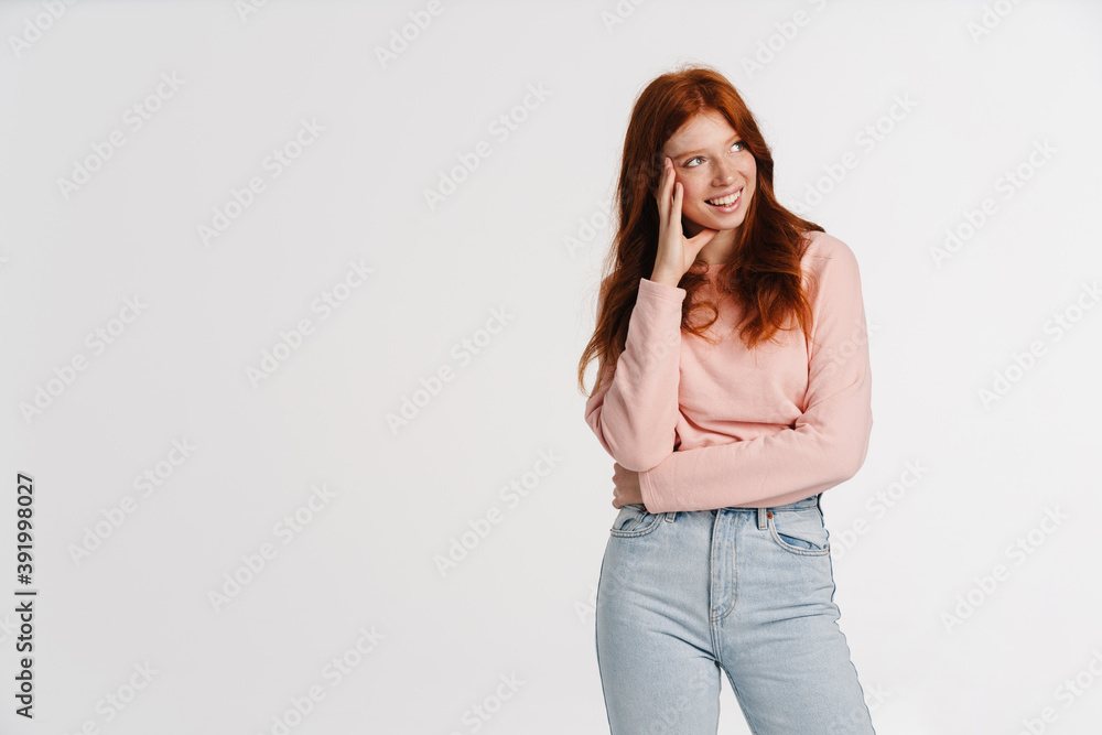 Ginger beautiful joyful girl smiling and looking aside Ginger beautiful joyful girl smiling and looking aside