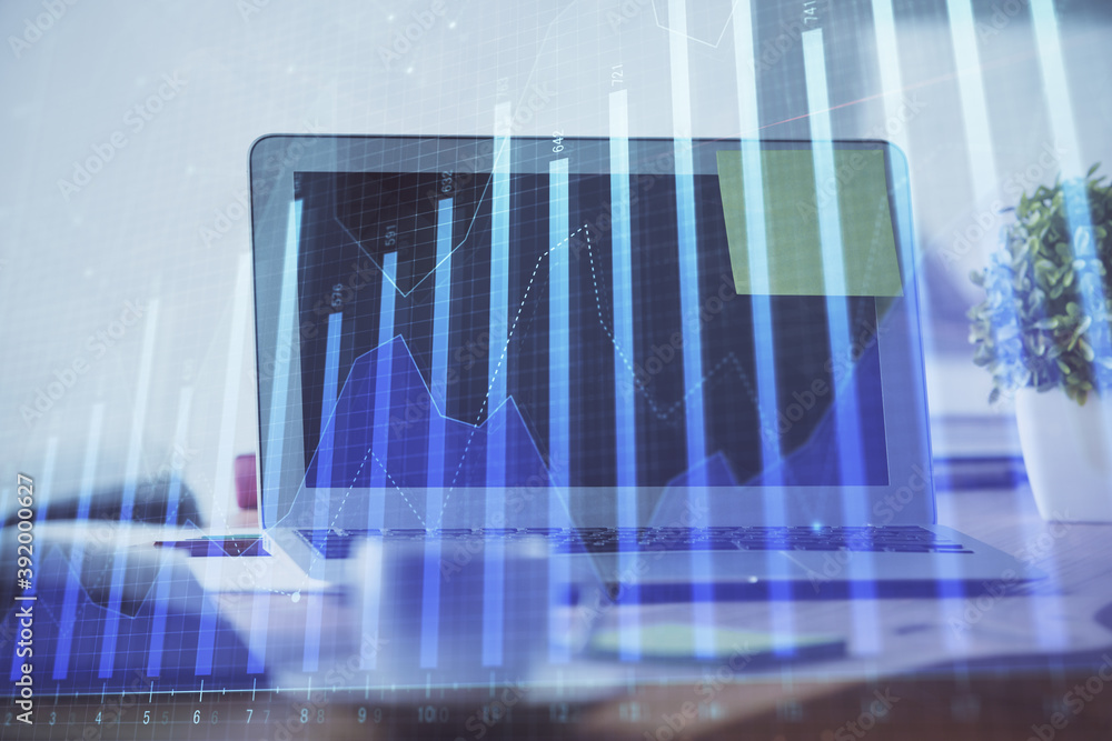 Forex Chart hologram on table with computer background. Multi exposure. Concept of financial markets. Forex Chart hologram on table with computer background. Multi exposure. Concept of financial markets.