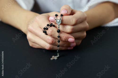 Fotografie Spiritual prayer to god, with verve or rosary in the hands of a young girl