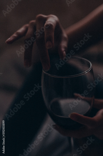 hand with a glass of wine