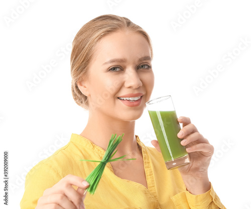 Young woman with wheatgrass...
